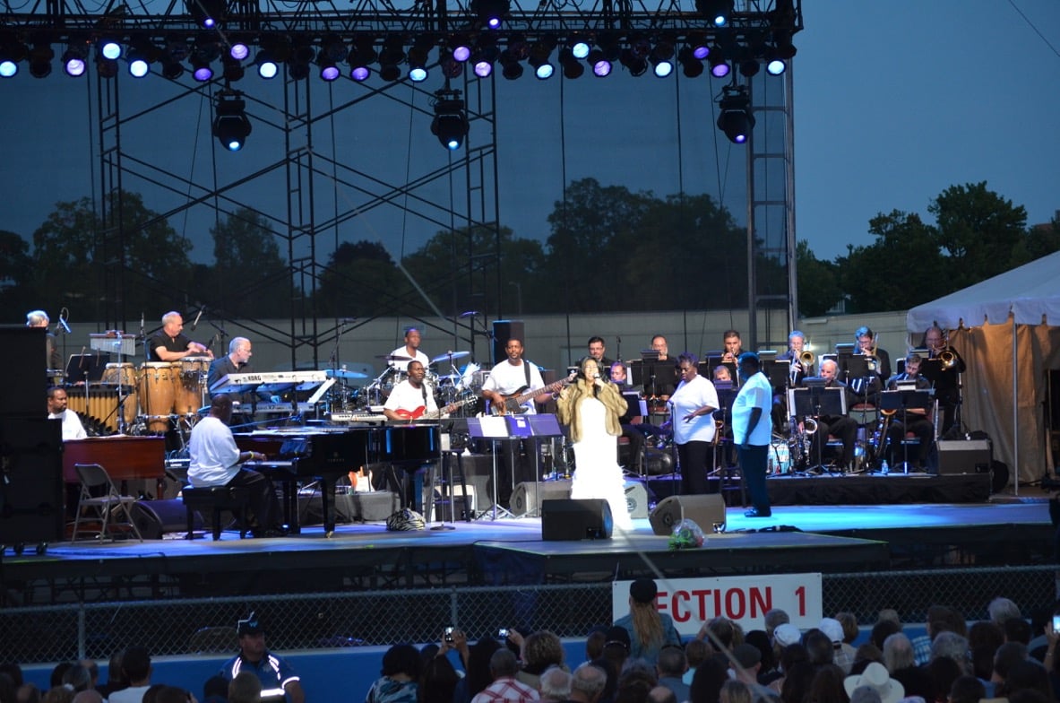 Eric Schoor (sax), Matt Anton (tpt), Kurt Cowling (pno) of Platinum and Kyle Samuelson (bone) of North Coast Orchestra performing with The Queen of Soul, Aretha Franklin.