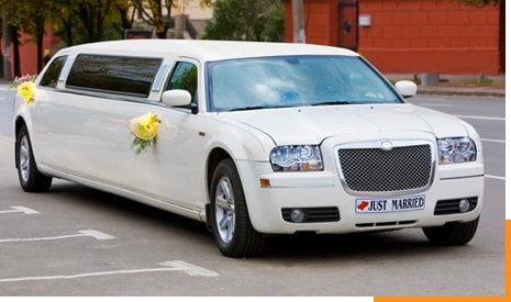 White Wedding Limousine on the Road
