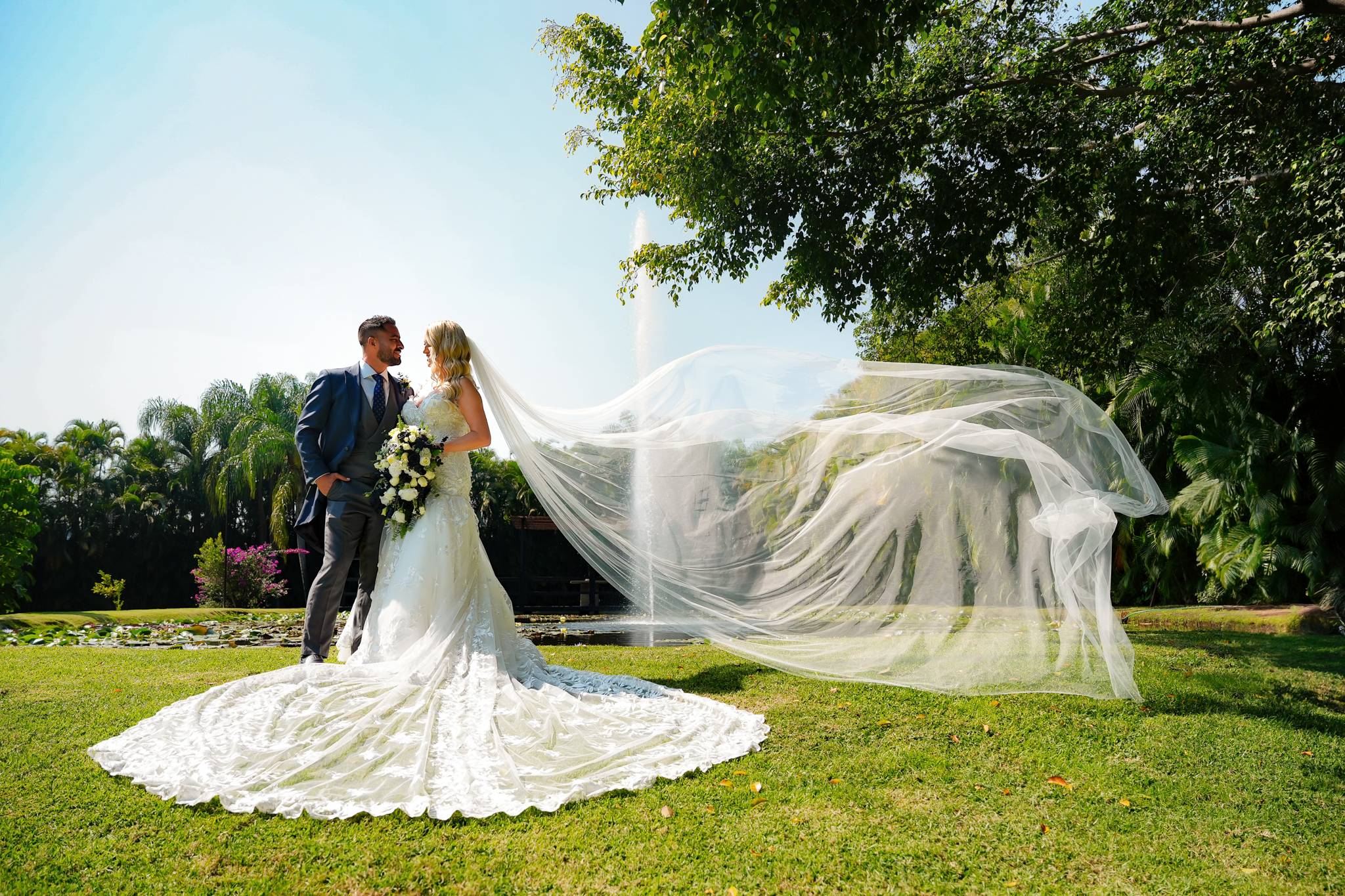 Romantic portraits of Tee and Abraham among natural garden surroundings.