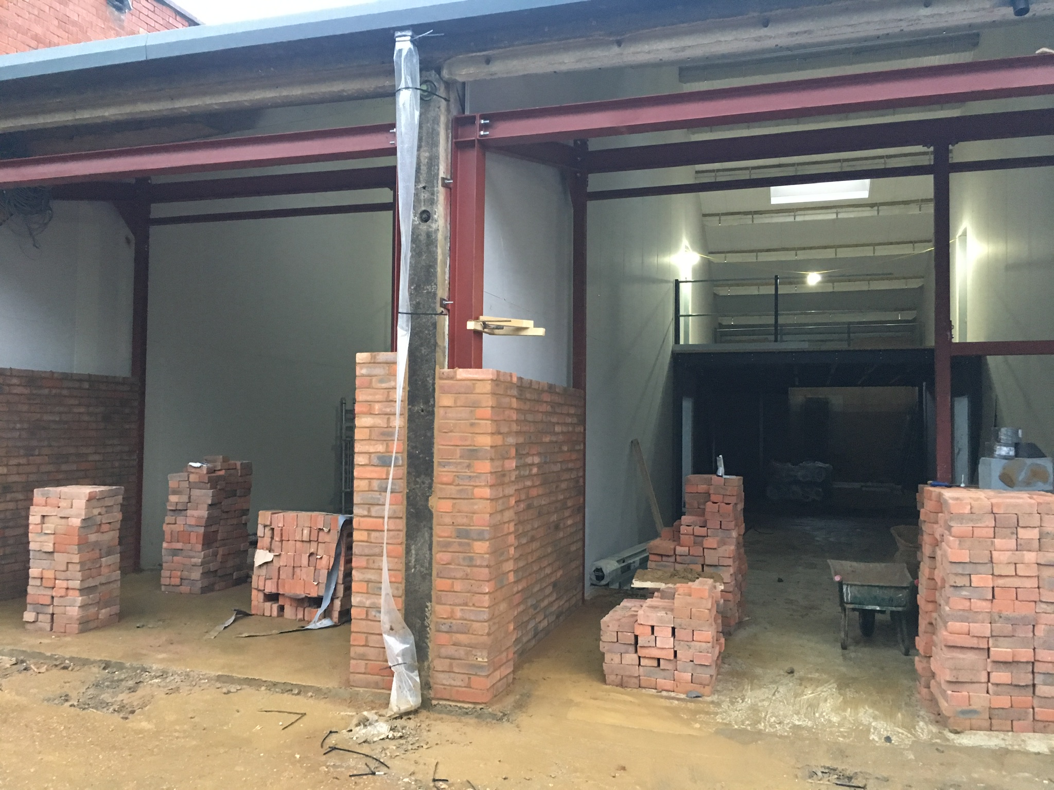 Bricks were chosen to cover the steel work and make an attractive and durable entrance to each unit. Bricks would create the look we wanted for "The Old Print Works"