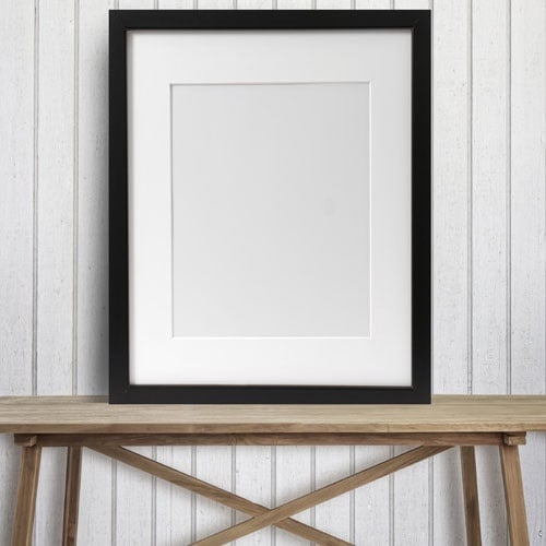 Black Picture Frame on Wood Table