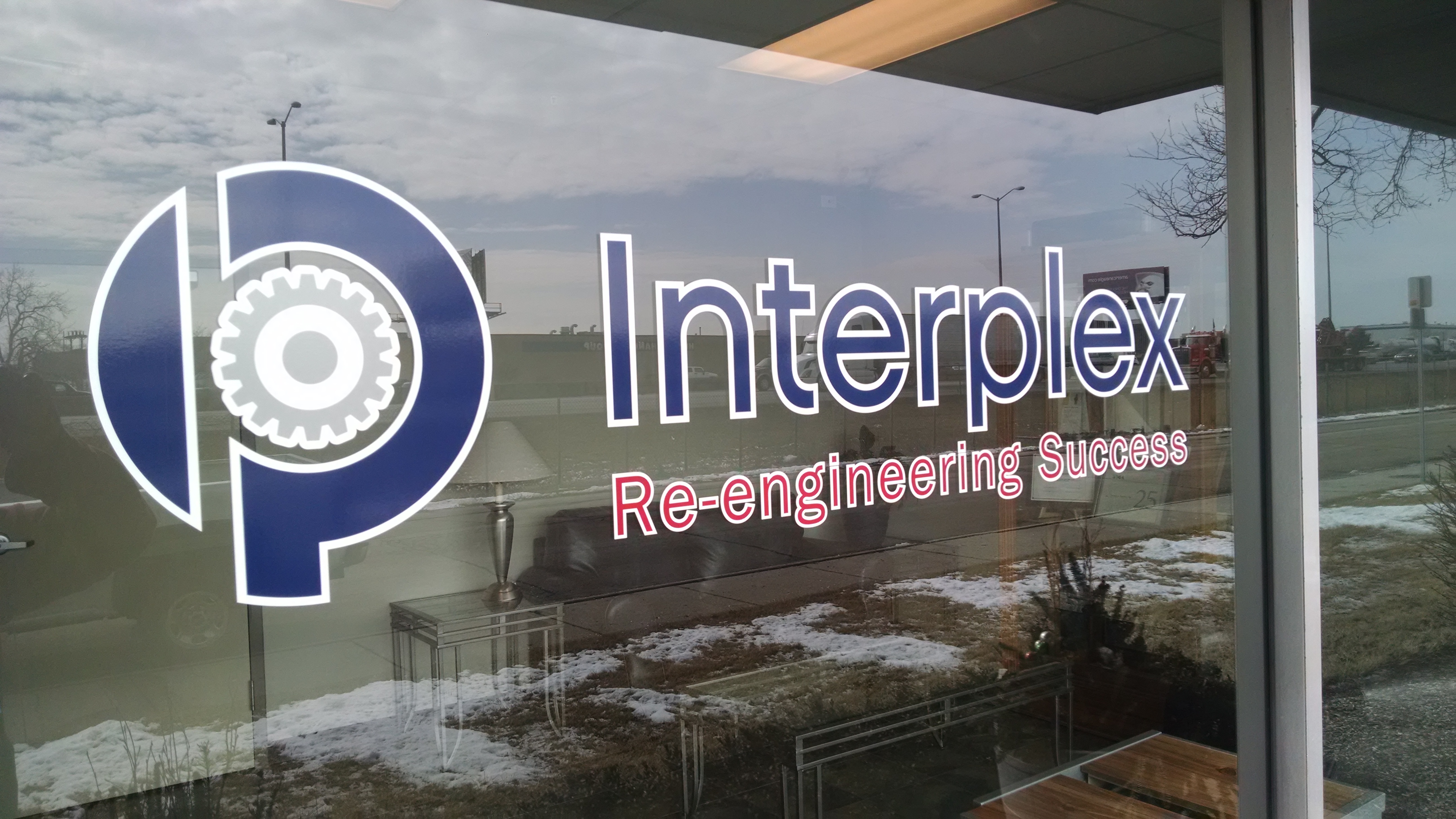 Interplex logo & lettering on window