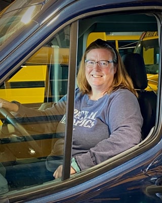Sue has logged many enjoyable miles driving kids from grades K-12 kids for us out of Waconia since 2003!  Currently she drives 18-20 year old transition students.

She has met many, many students and takes the time to get to know them all.

In her free time, Sue likes reading, taking walks with her dog and she also coaches Special Olympics - check out the sweatshirt!