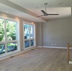 First floor family room flaunting 12' ceiling elevation, recess lighting, and huge energy efficient windows.
