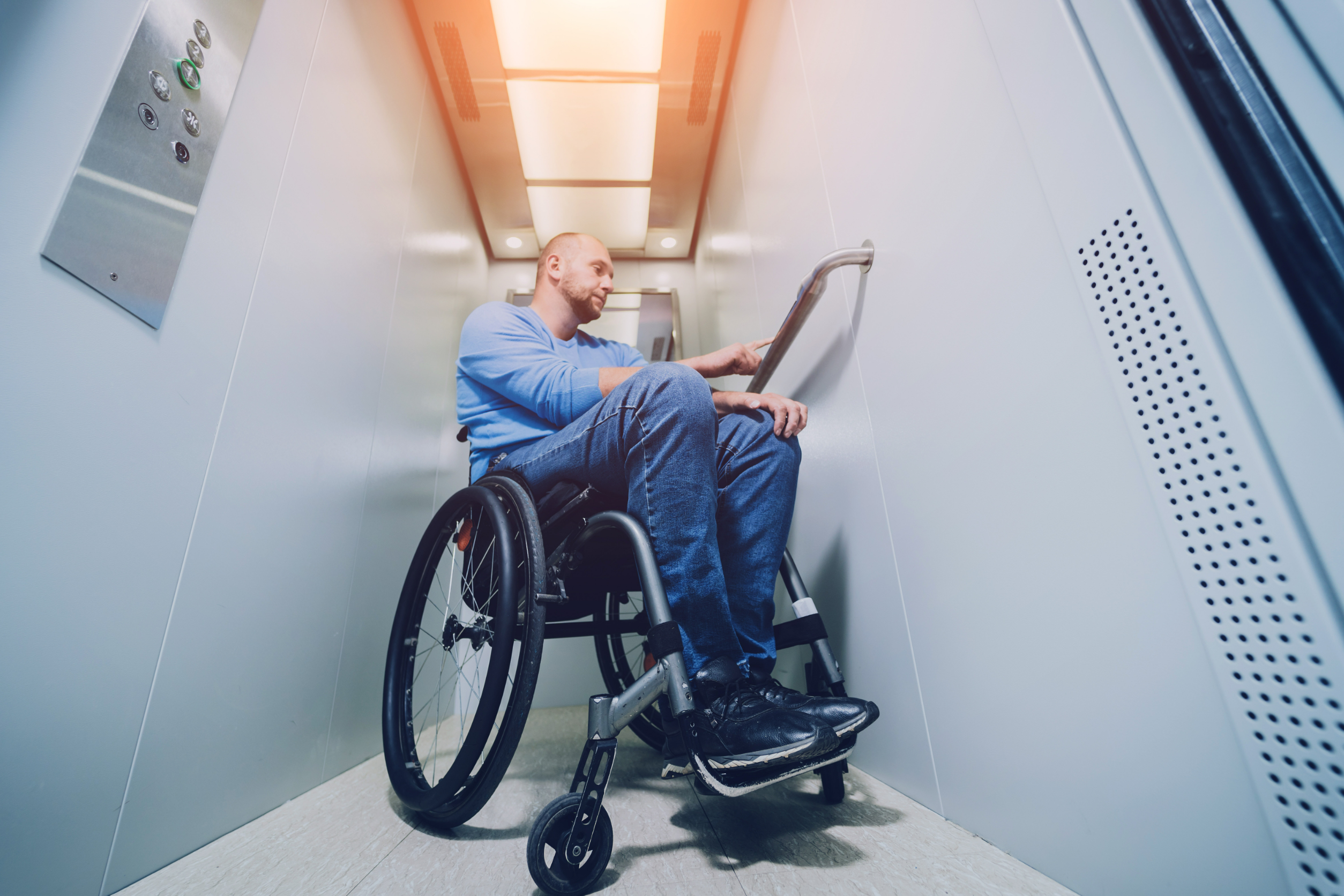 Disabled man in elevator