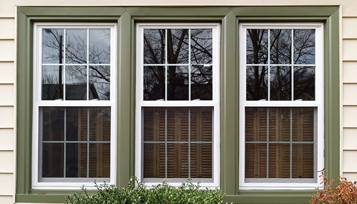New White With Green Trim Vinyl Replacement Windows.