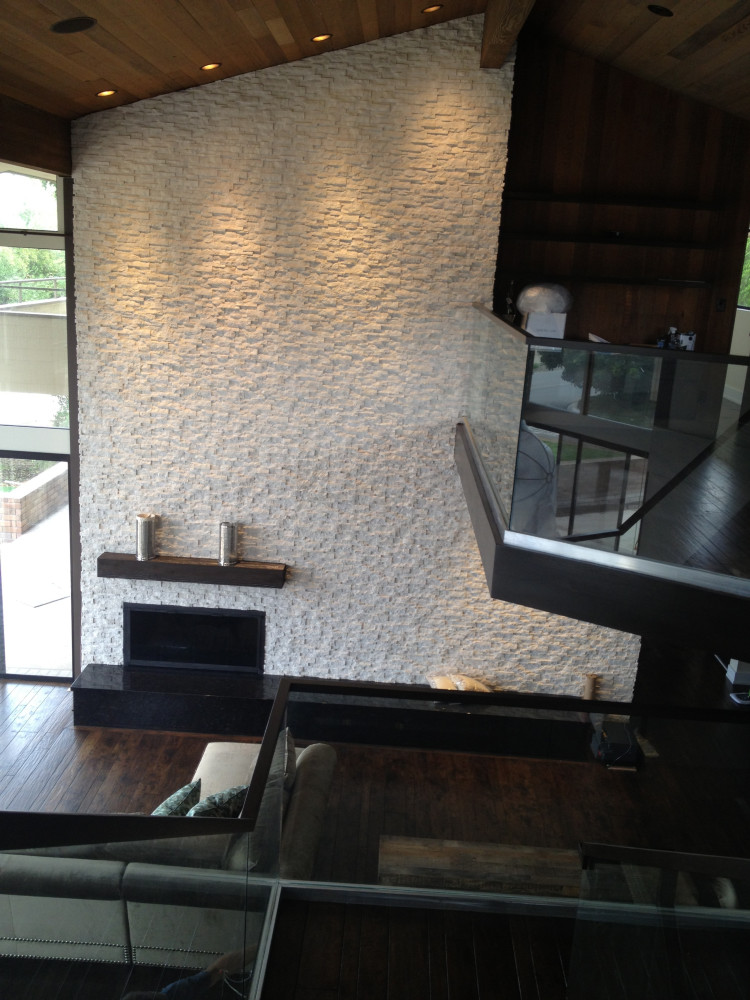 AFTER - Imported limestone and glassed staircase.