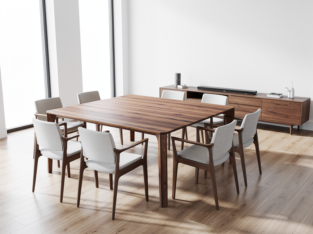 Modern wooden dining table with upholstered chairs in bright minimalist dining room