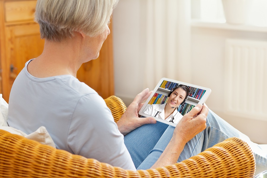 Elderly Woman Using Telemedicine on iPad