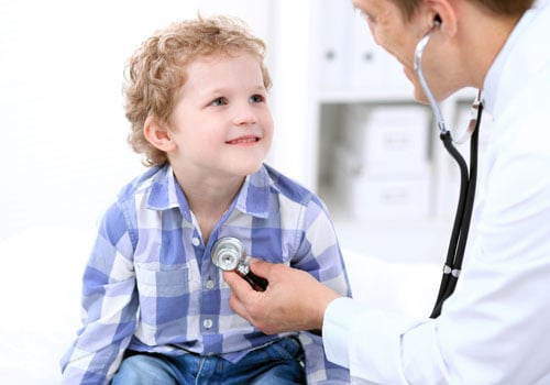Doctor Male Examining a Child Patient