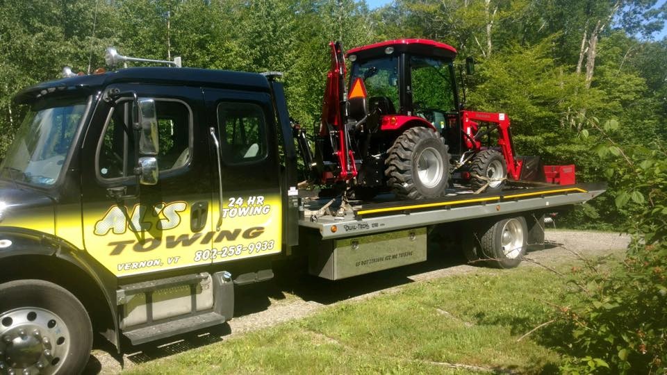 Our new truck delivering a new tractor for a Gary's Power Equipment customer. We do much more than tow broken down vehicles! Call us the next time you need a heavy or large item moved!