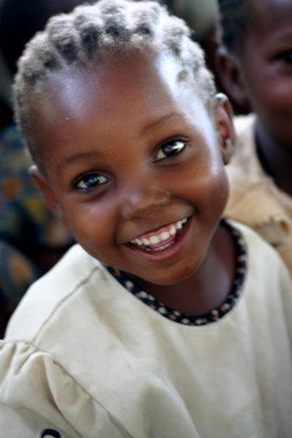 Even though this little girl was part of a feeding of starving children she still carries hope on her face. 