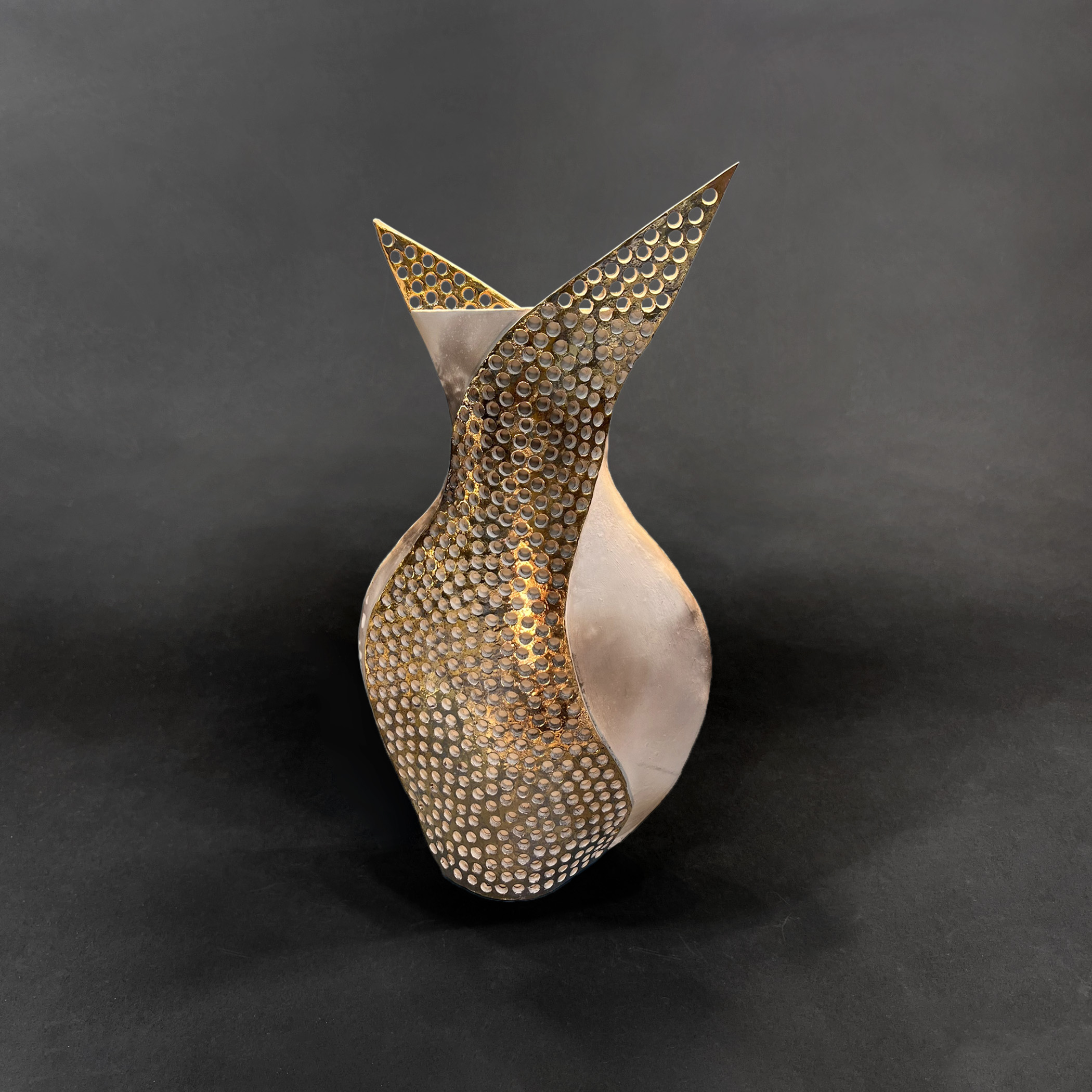 Athena
pit-fired, gold-lustered porcelain
17" h x 9.5" w x 5" d