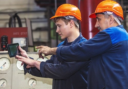 Men Work on the Old Factory